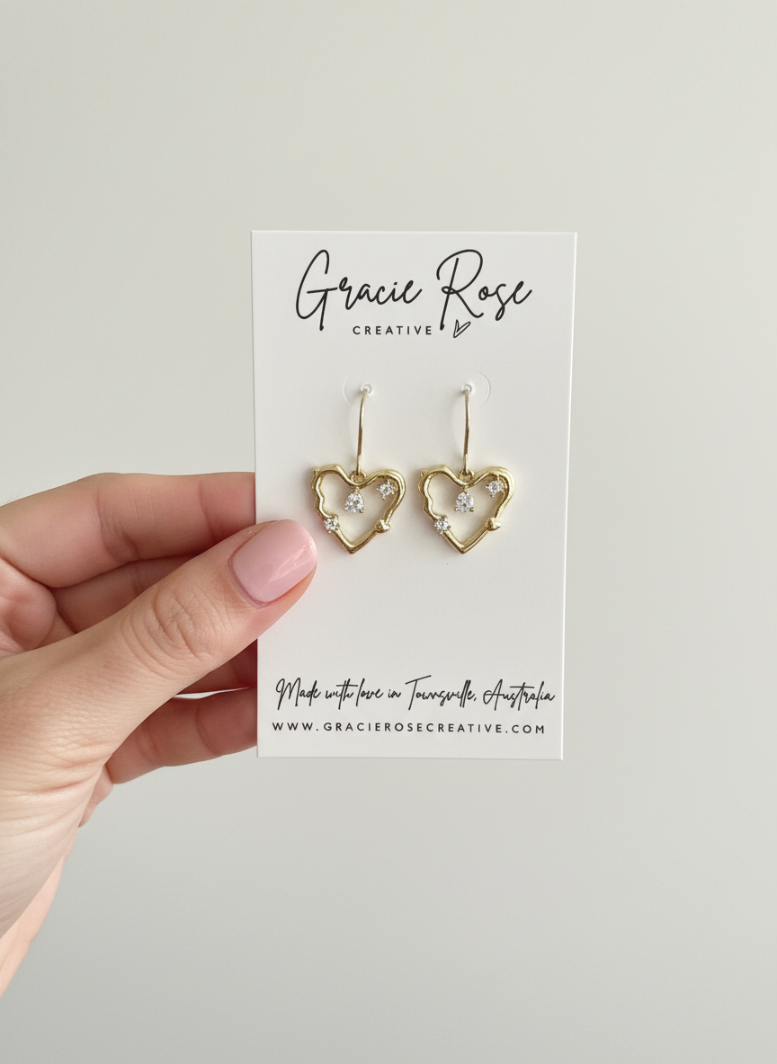 Model wearing Amour Sparkle Heart Drop Earrings, highlighting the romantic and feminine appeal suitable for anniversaries and romantic gestures.
