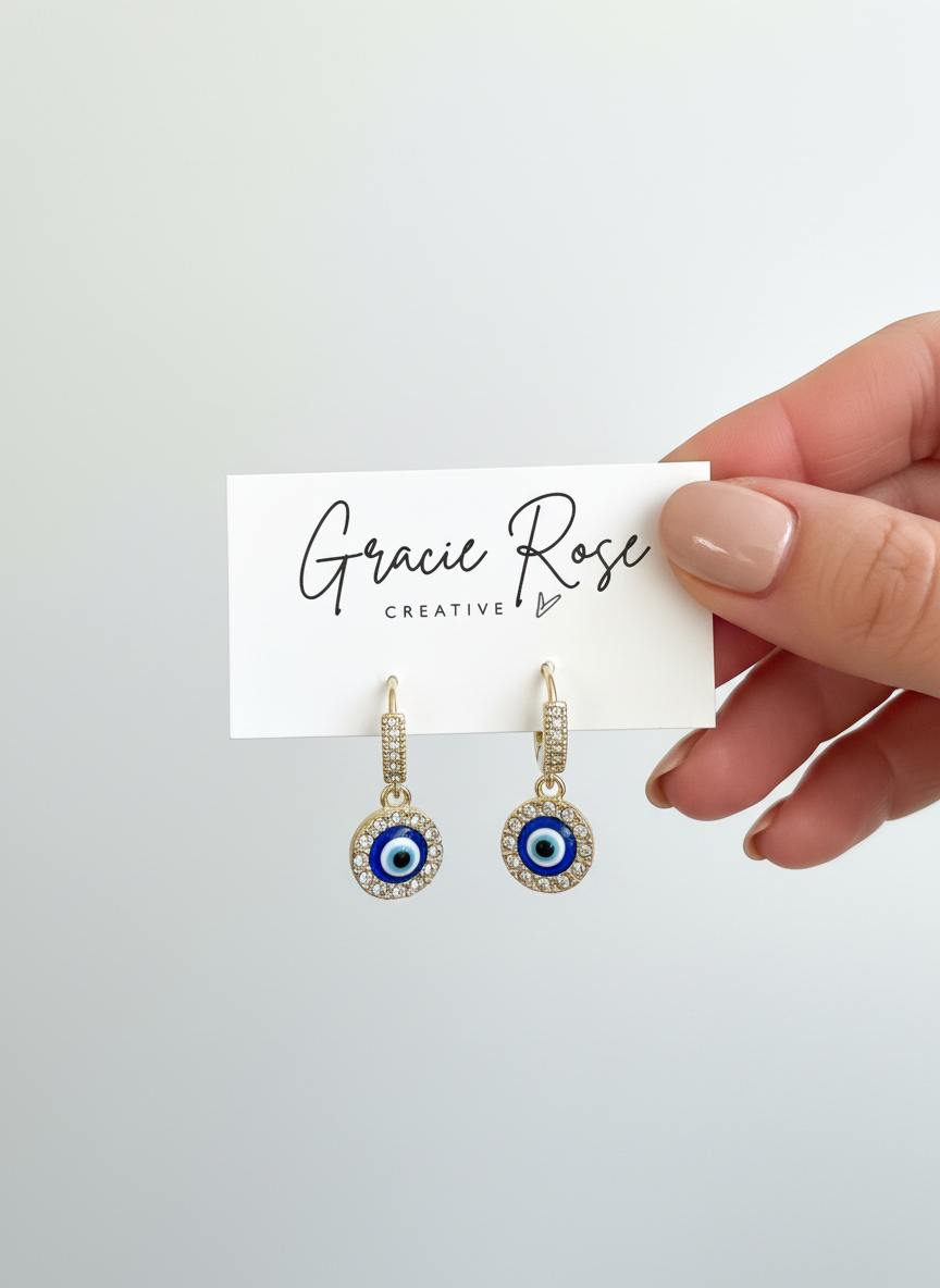 Evil Eye Crystal Huggie worn by a model, highlighting the elegant design and versatility for casual or dressy occasions.
