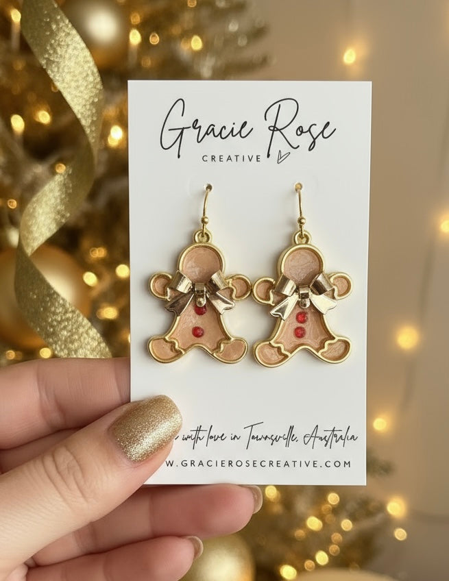 Close-up of gingerbread men earrings in red by Gracie Rose Creative, featuring cute design on a branded card, ideal for Christmas gifting.