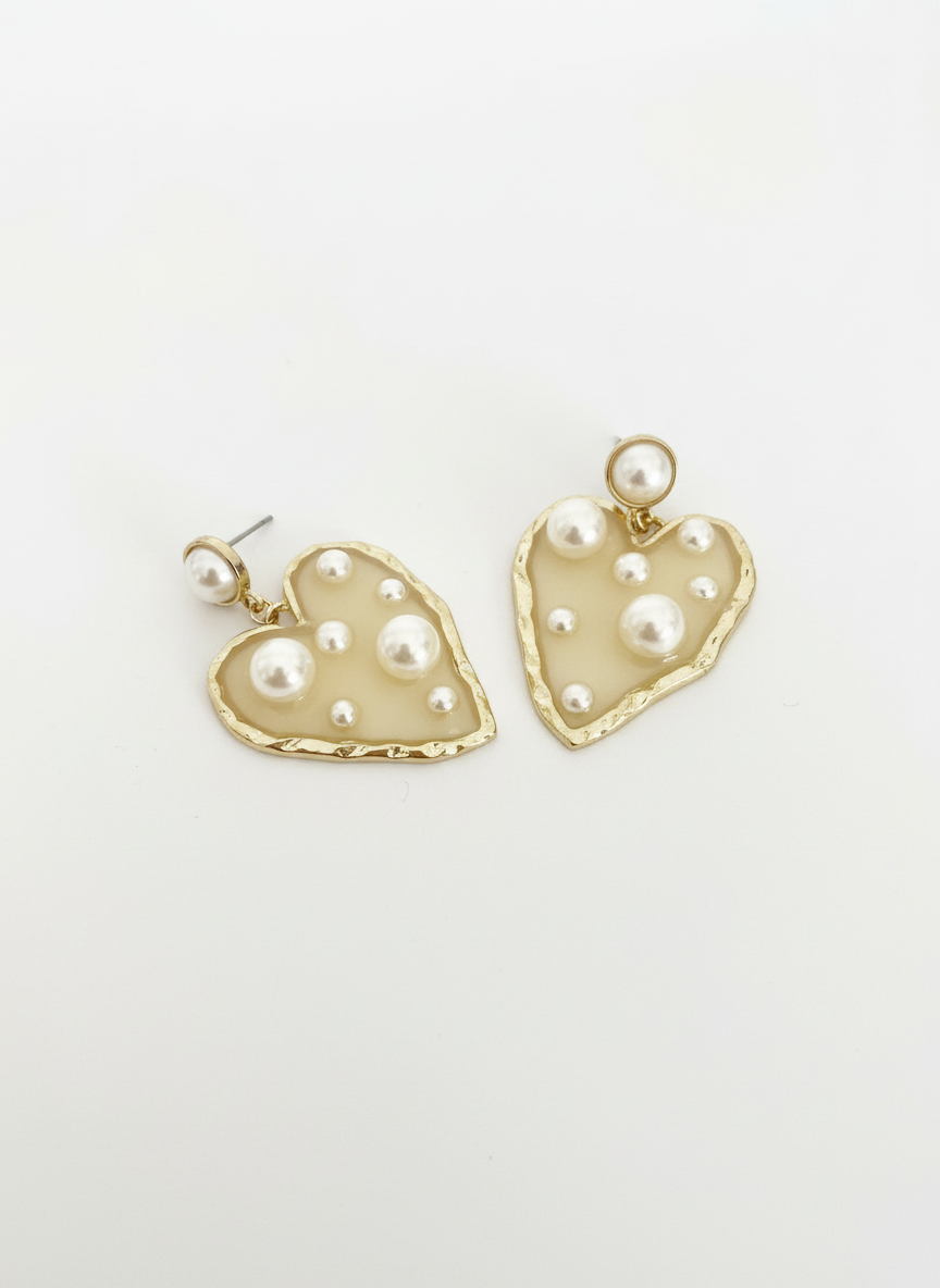 Opulent Hearts by Gracie Rose Creative, elegant gold-toned heart earrings adorned with lustrous pearls on a white background.