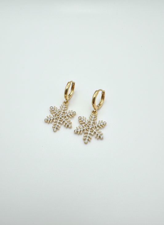 Sparkle Snowflake Huggies by Gracie Rose Creative, featuring playful gold snowflake charm earrings on a clean white background.