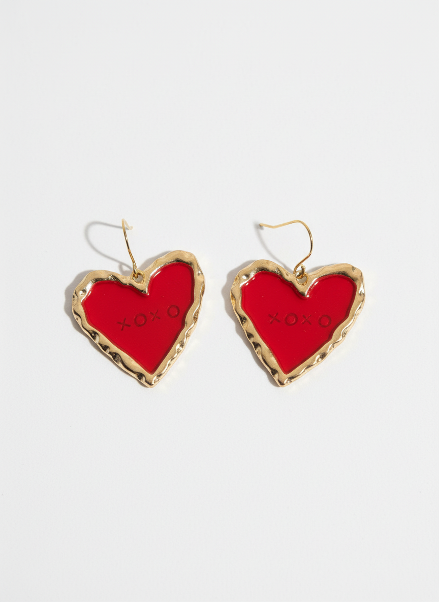 Handmade heart-shaped XOXO earrings in red, crafted from polymer clay and framed in gold tones.