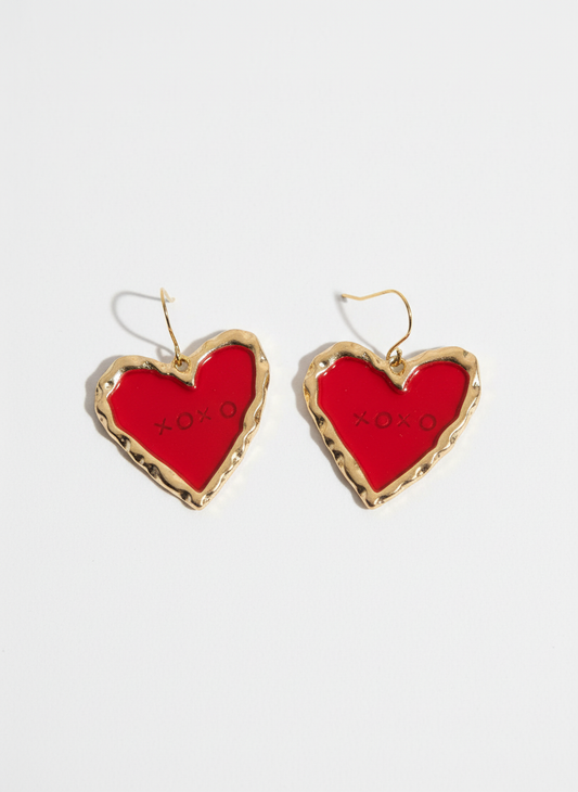Handmade heart-shaped XOXO earrings in red, crafted from polymer clay and framed in gold tones.