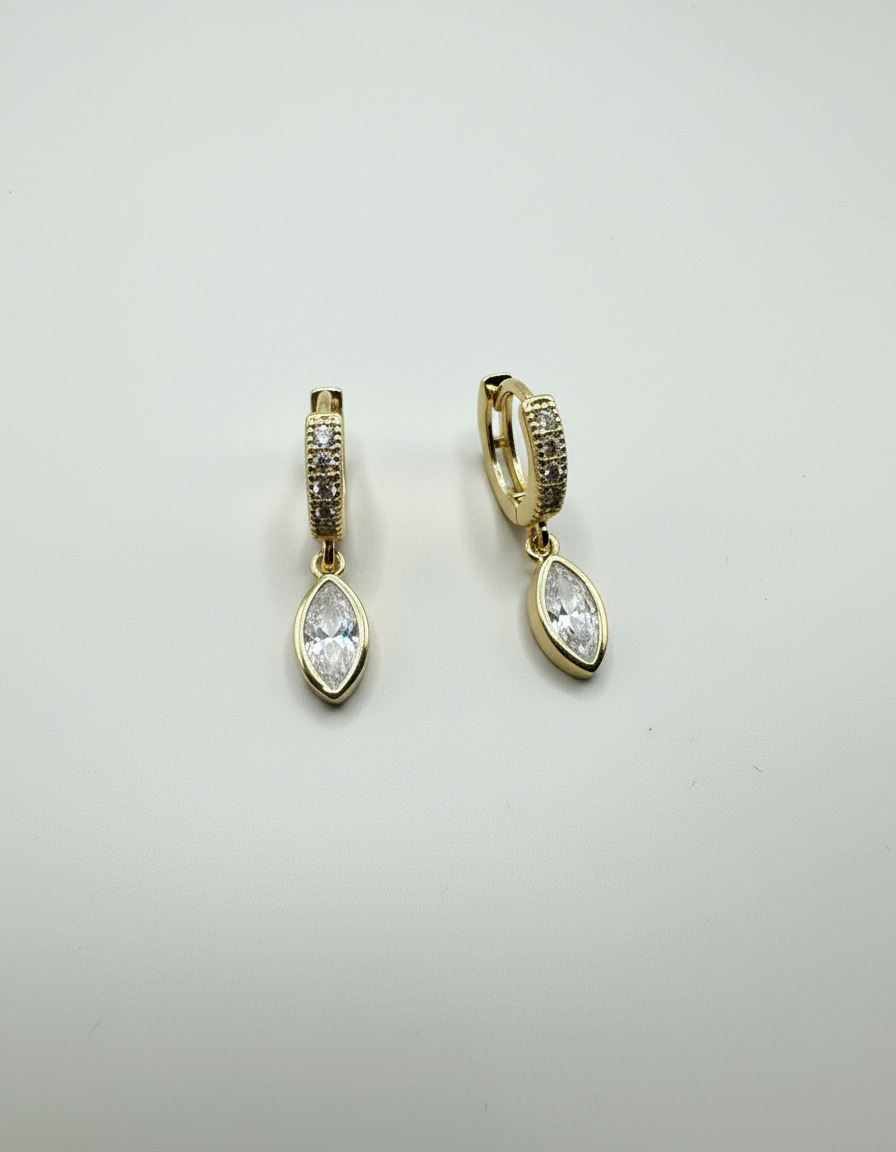 Close-up view of the Halo Drop Huggies by Gracie Rose Creative, highlighting the pavé-set huggie and marquise-cut crystal drop design.