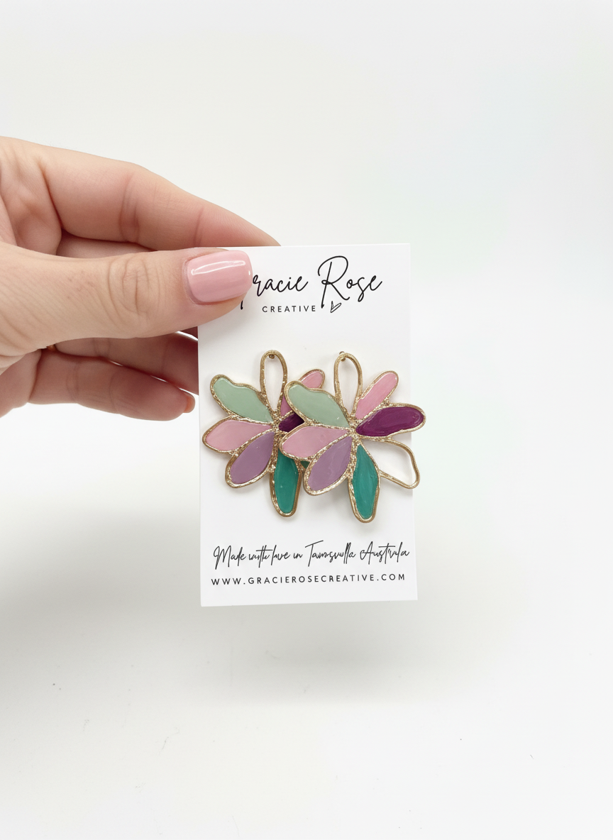 Wearing the Fleur de Lune earrings with a casual outfit, adding a playful yet sophisticated touch to the look.