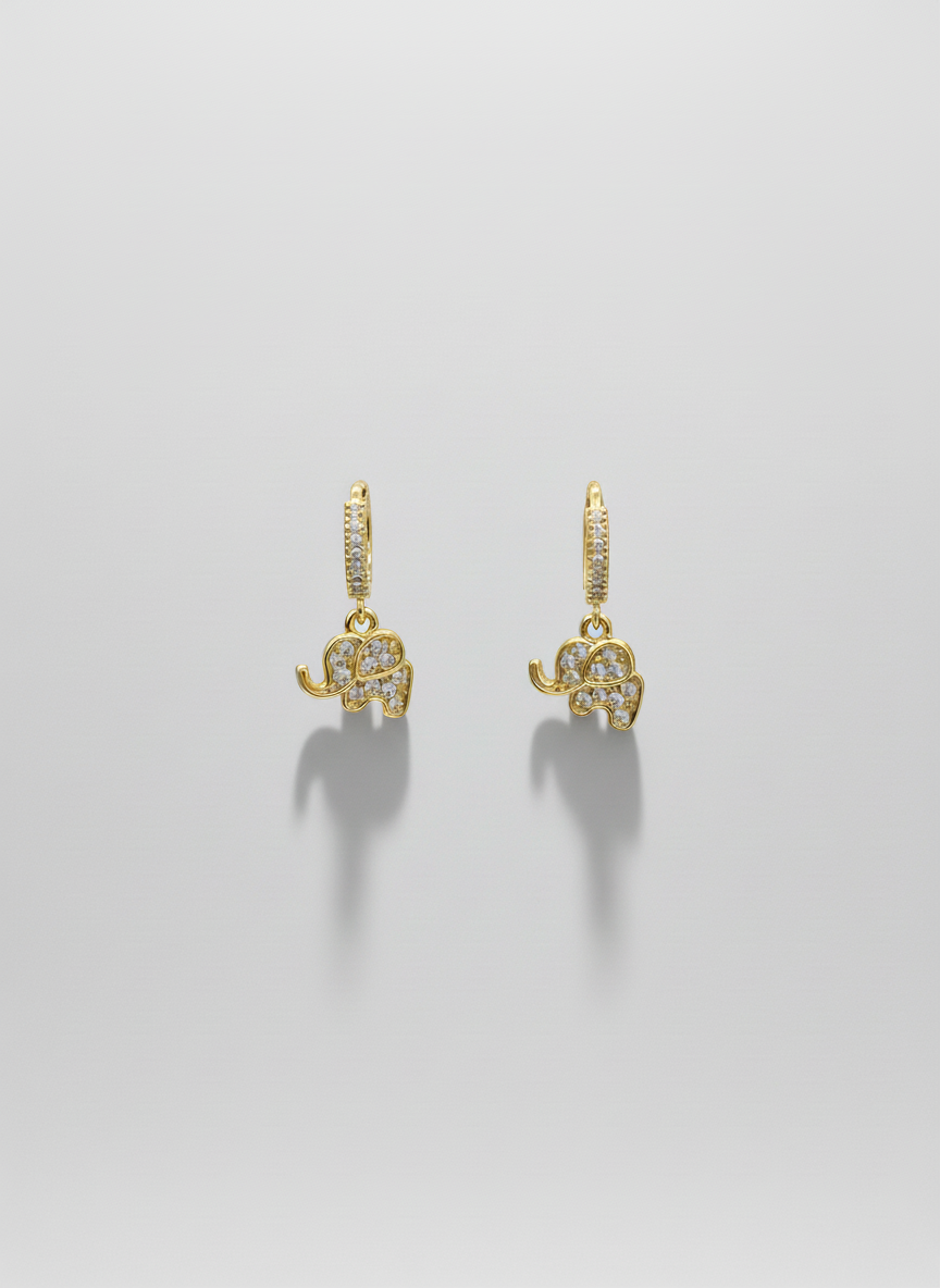 Lucky Elephant Drops by Gracie Rose Creative - Charming gold huggies with sparkling elephant charms displayed on a neutral background.