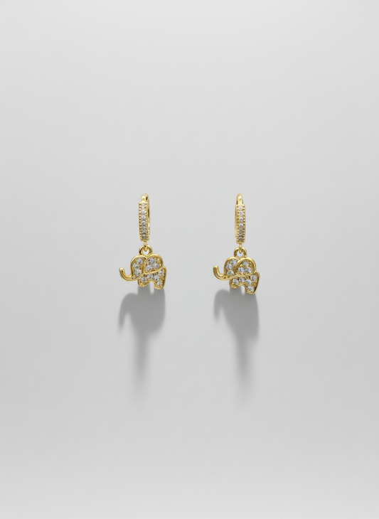 Lucky Elephant Drops by Gracie Rose Creative - Charming gold huggies with sparkling elephant charms displayed on a neutral background.