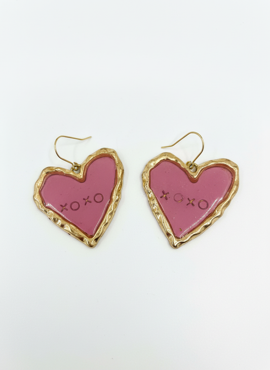 XOXO earrings in pink, heart-shaped design, handmade by Gracie Rose Creative, featuring a charming gold-tone frame.
