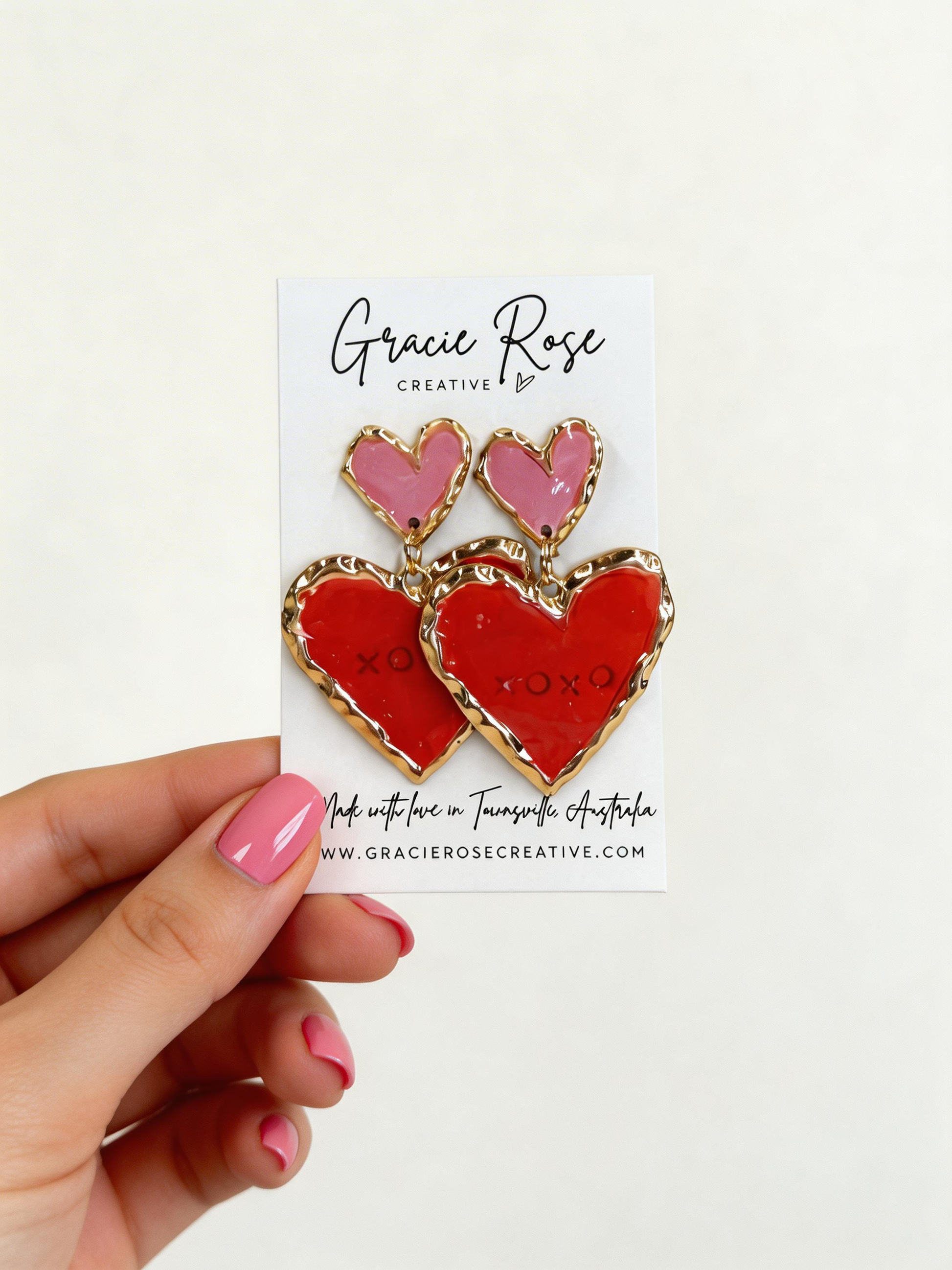 Bold and lightweight Double Sweetheart in Pink & Red statement earrings handcrafted from polymer clay, ideal for date nights and celebrations.