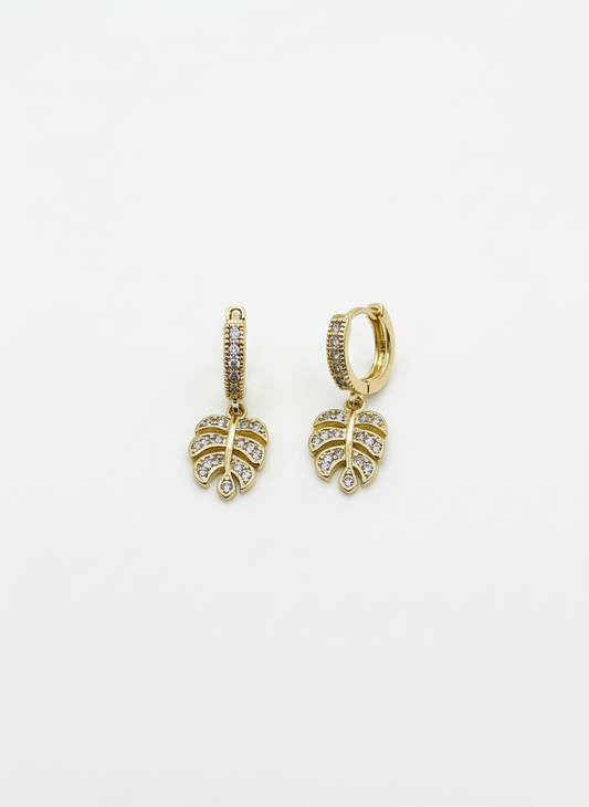 Stylish Monstera Shine Huggies by Gracie Rose Creative featuring sparkling crystal-studded leaves, perfect for adding a touch of tropical elegance to your look.