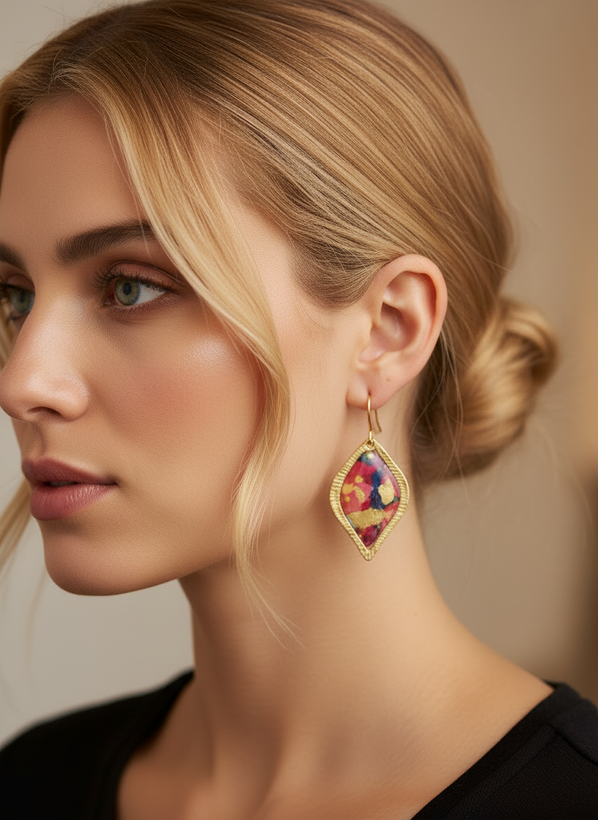 Stylish model wearing Festival Petals earrings by Gracie Rose Creative, showcasing the colorful design and elegant golden frame, ideal for any occasion.