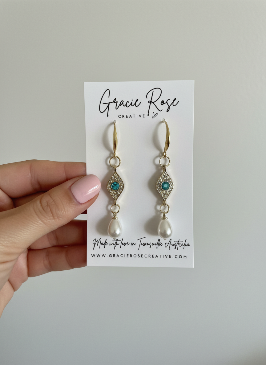Model wearing Evil Eye Pearl Drops, highlighting the elegant drop earrings in a chic setting, perfect for a stylish look.