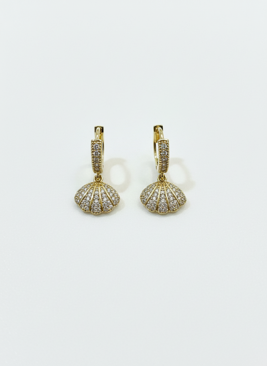 Gilded Seashells - Golden shell huggies earrings with shimmering stones, showcasing coastal elegance.