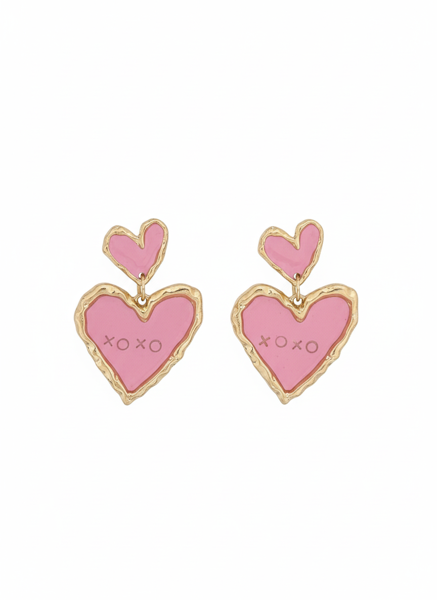 Double Sweetheart in Pink statement earrings featuring a layered heart design in vibrant red and soft pink, elegantly framed in gold detailing.