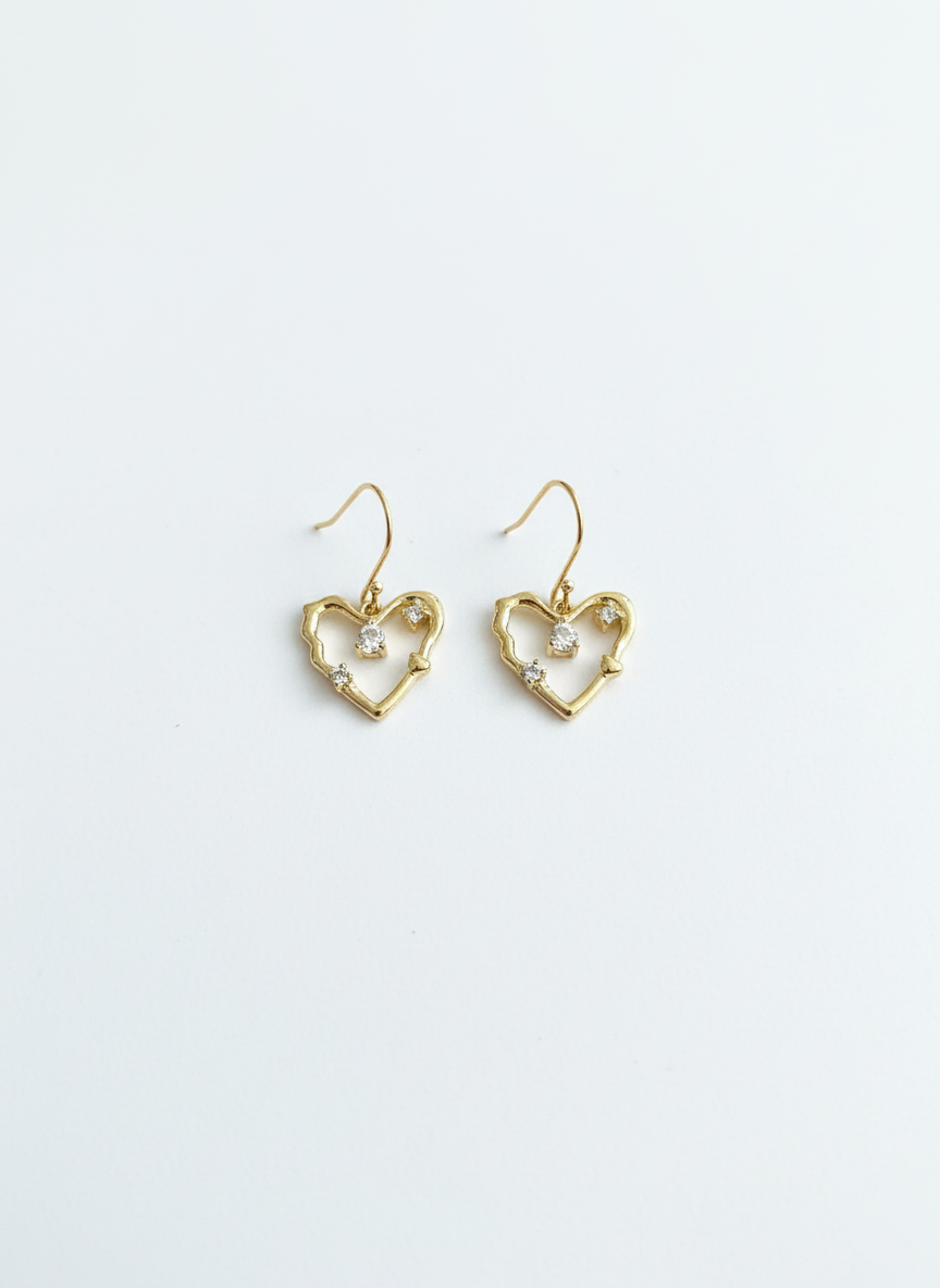 Amour Sparkle Heart Drop Earrings showcasing a delicate gold heart design with crystal accents, perfect for adding a touch of glamour to any outfit.