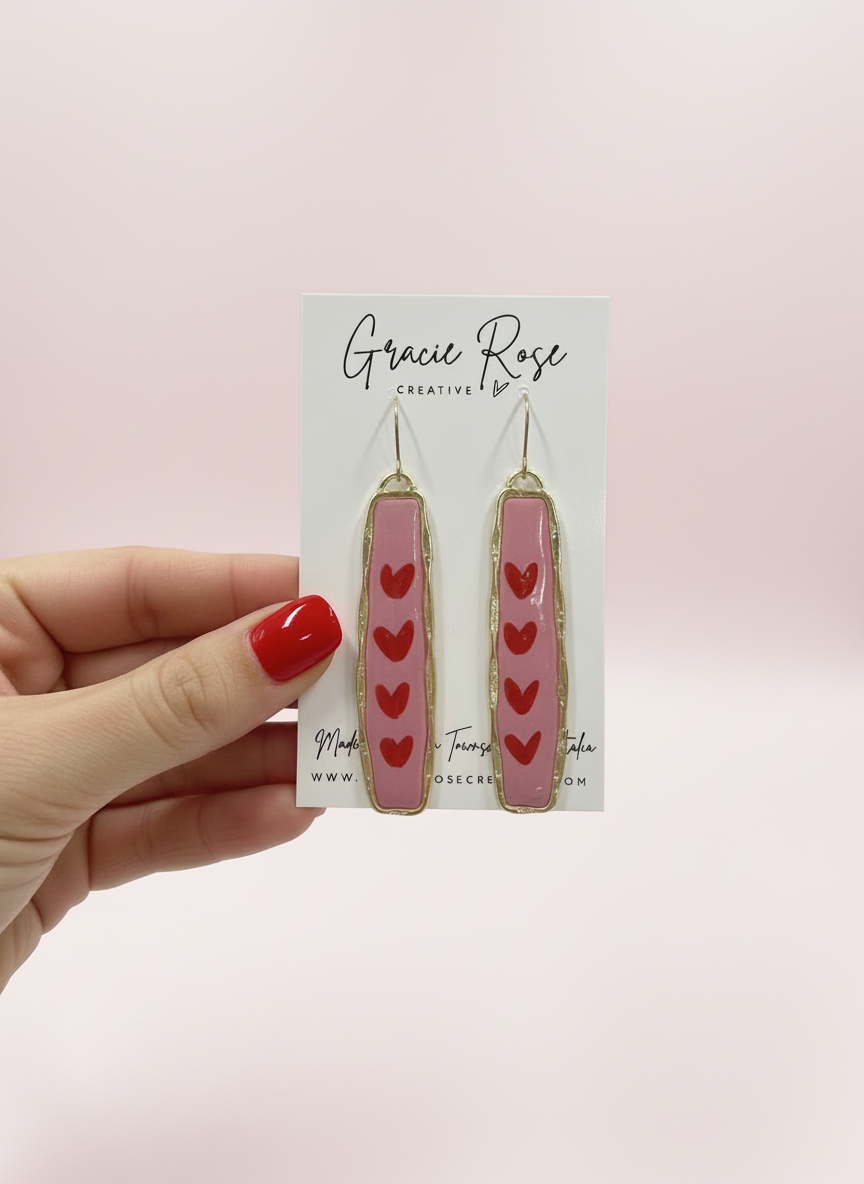 Model wearing 'Endless Love' pink earrings, highlighting the joyful and bold style that complements everyday fashion.