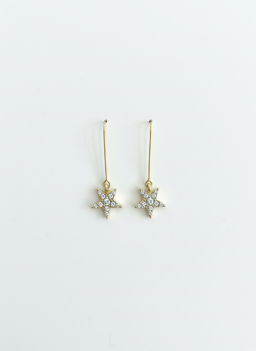 Starlight Drops earrings by Gracie Rose Creative, featuring shimmering star dangles with a gold plated alloy and sparkling diamantés for a celestial glow.