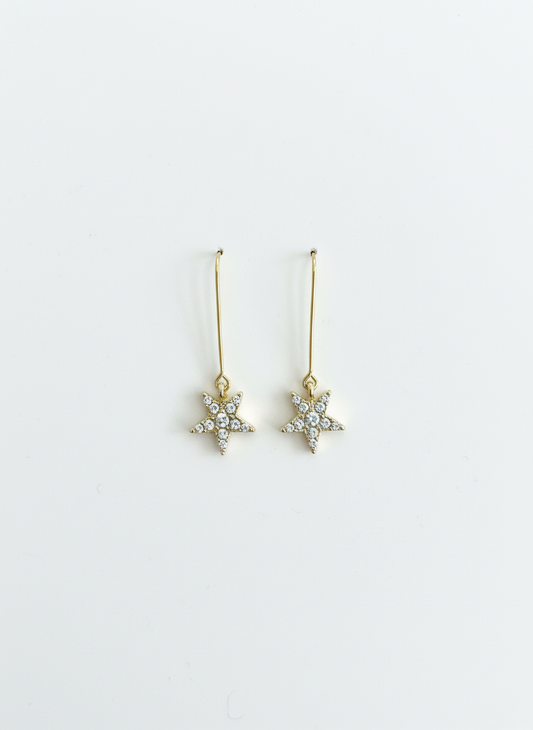 Starlight Drops earrings by Gracie Rose Creative, featuring shimmering star dangles with a gold plated alloy and sparkling diamantés for a celestial glow.
