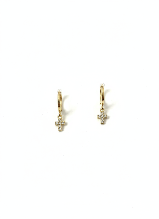 A pair of lightweight gold huggies featuring sparkling cross charms, designed by Gracie Rose Creative, perfect for adding an elegant touch to any outfit. Divine Huggies earrings.