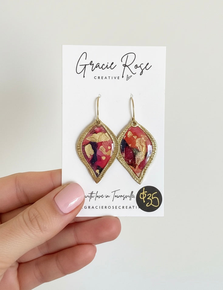 Handmade Festival Petals earrings by Gracie Rose Creative, featuring vibrant colors and shimmering gold accents in a stylish design.