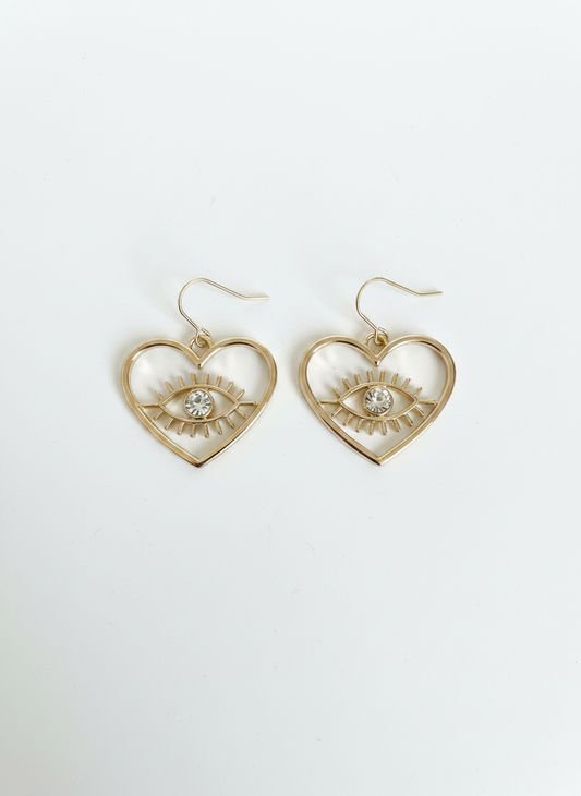 Eternal Eye Heart Earrings featuring a radiant diamanté evil eye at the center, gold-plated design perfect for adding a touch of elegance and protection to any outfit.