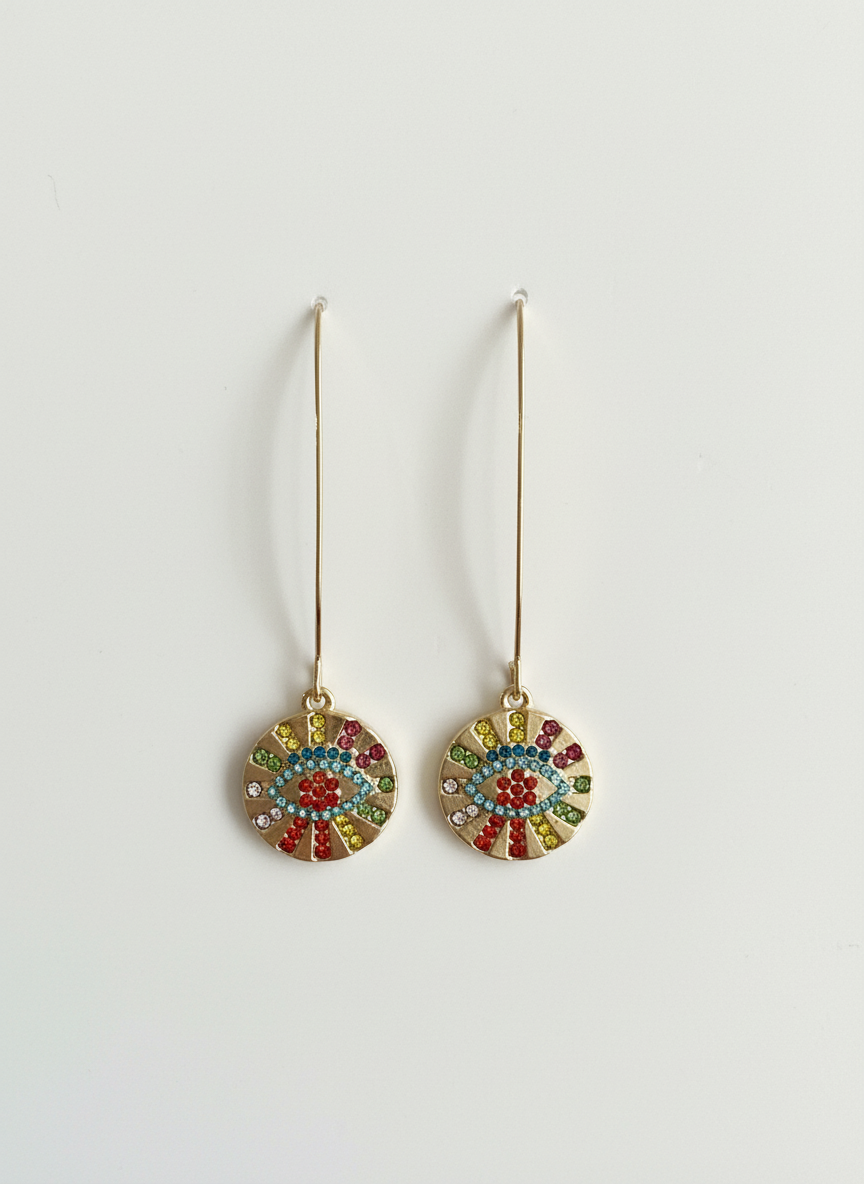 Close-up of Prism Protector Earrings by Gracie Rose Creative, highlighting the multicolour crystal evil eye design on gold-toned threader hooks.