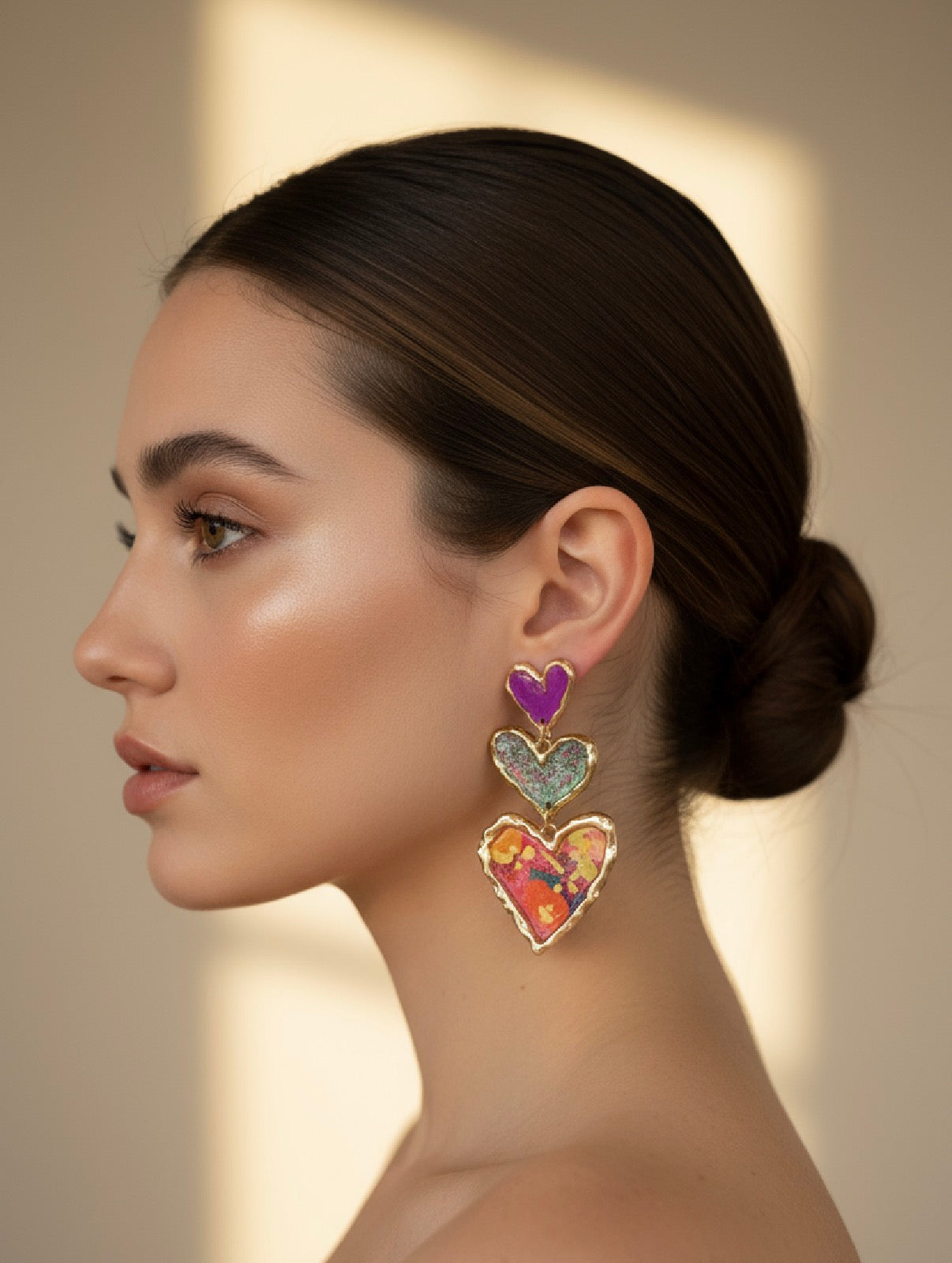 A model showcasing elegant oversized heart earrings by Gracie Rose Creative, embodying modern romance - Cross Your Heart (floral sparkle).