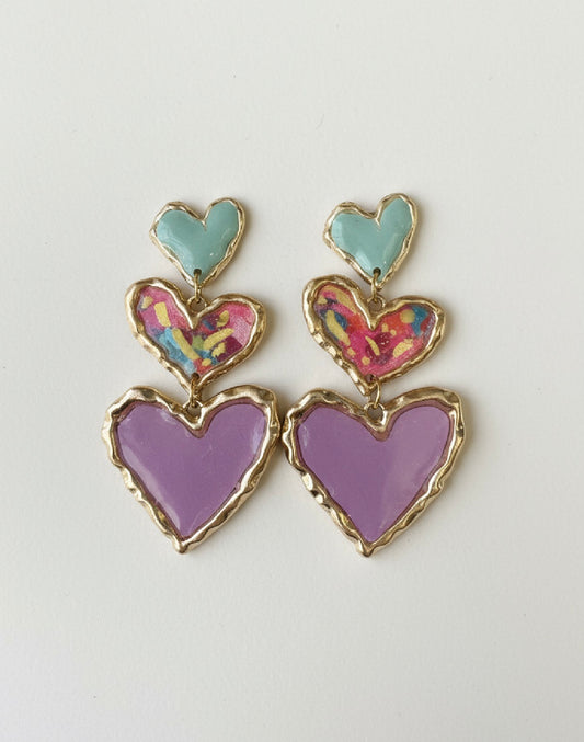 Fashionable handcrafted Cross Your Heart earrings in floral sage design, showcasing a trio of lightweight sculpted hearts.