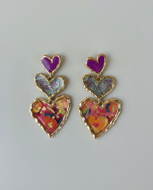 Colorful handmade earrings featuring a trio of sculpted hearts in vibrant hues by Gracie Rose Creative - Cross Your Heart (floral sparkle).