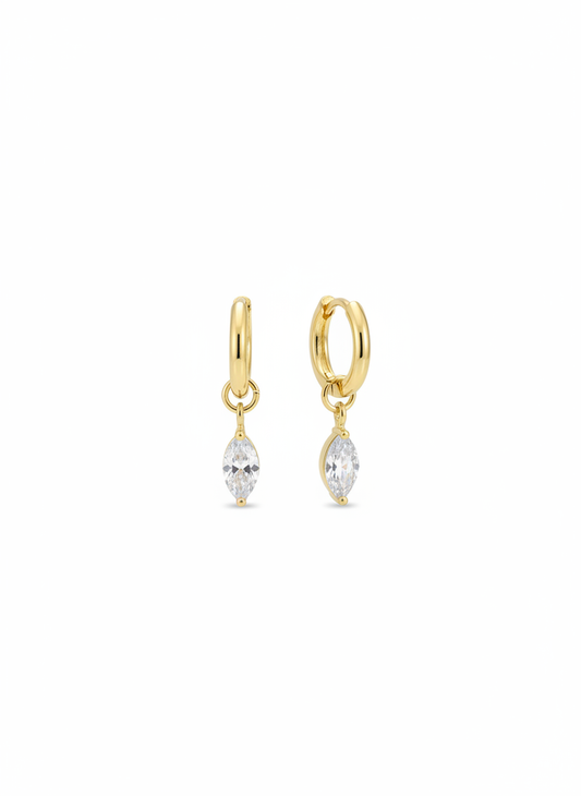 Crystal Kiss Huggies by Gracie Rose Creative featuring gold plated hoops with a sparkling charm.