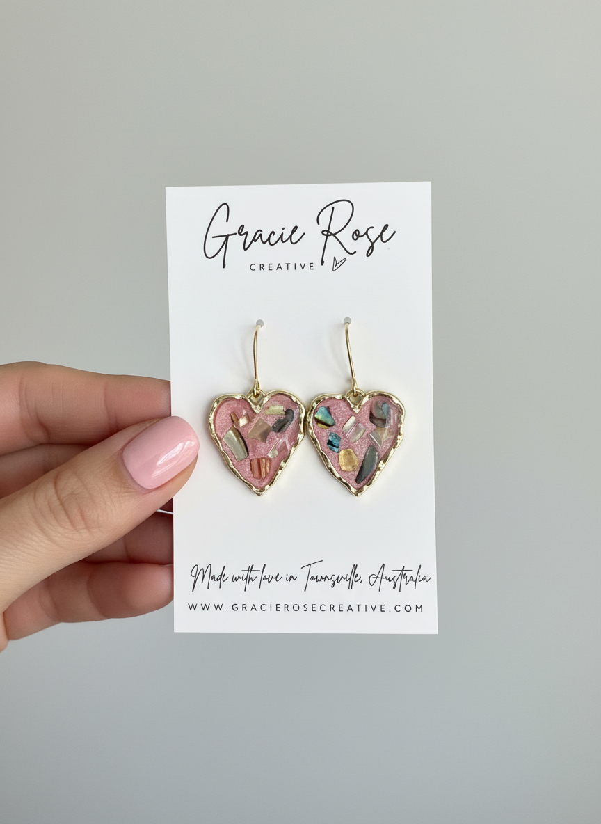 Close-up of Pink Mosaic Mini Hearts earrings by Gracie Rose Creative, displayed on branded packaging.