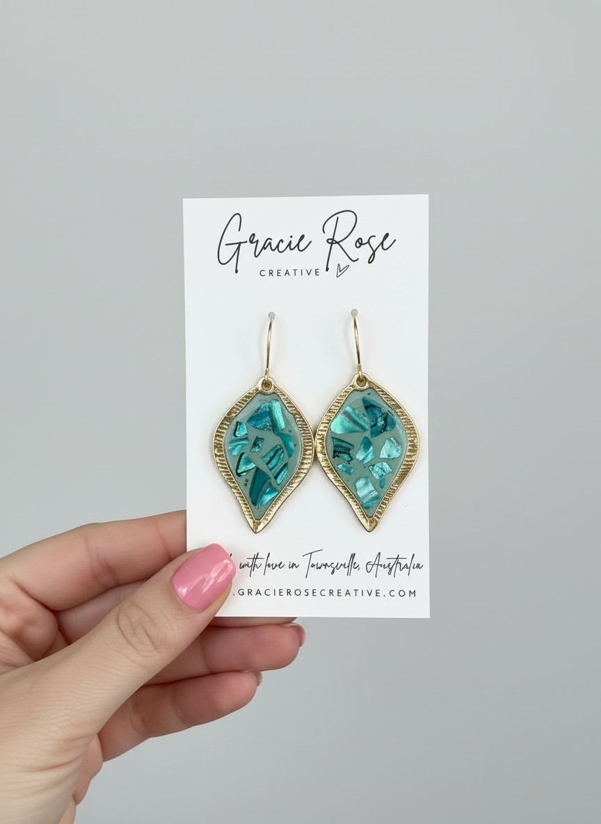 Handmade Sage Mosaic Drops earrings by Gracie Rose Creative, featuring a striking turquoise mosaic design set in a leaf-shaped frame, showcasing ocean tones and gold accents.