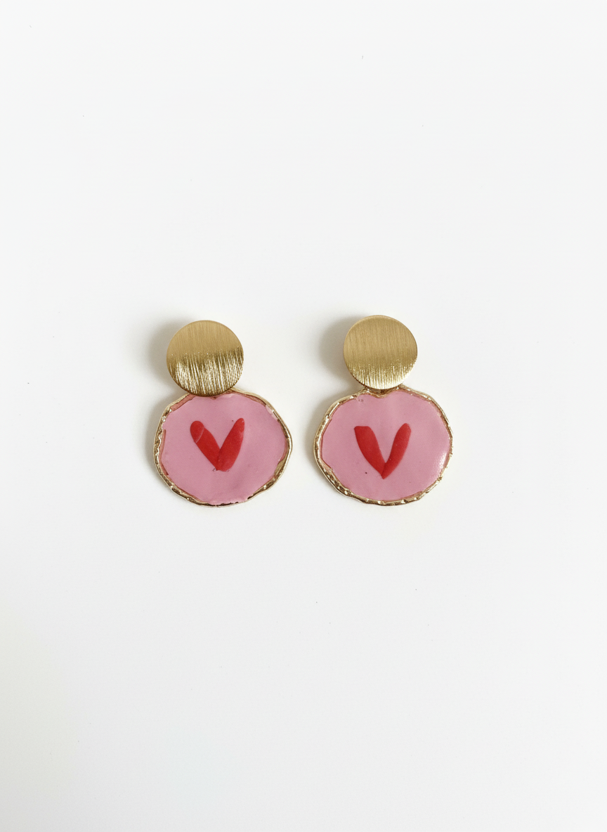 Handcrafted Sweetheart Pops earrings featuring soft pink circular drops with red heart details and elegant brushed gold studs, made by Gracie Rose Creative in Townsville, Australia.