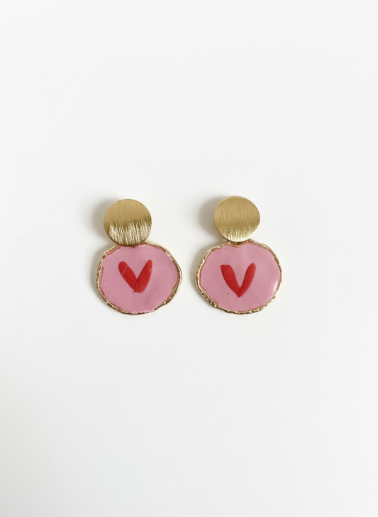 Handcrafted Sweetheart Pops earrings featuring soft pink circular drops with red heart details and elegant brushed gold studs, made by Gracie Rose Creative in Townsville, Australia.